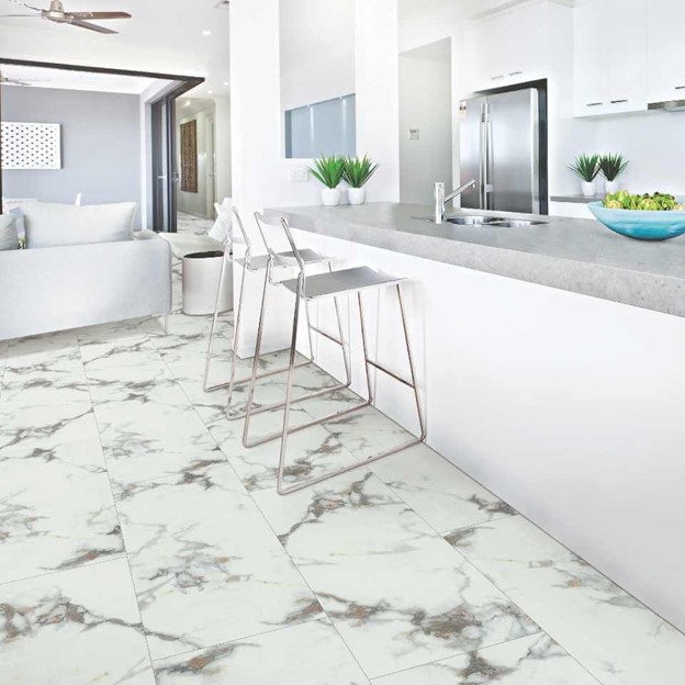 A kitchen with white marble flooring